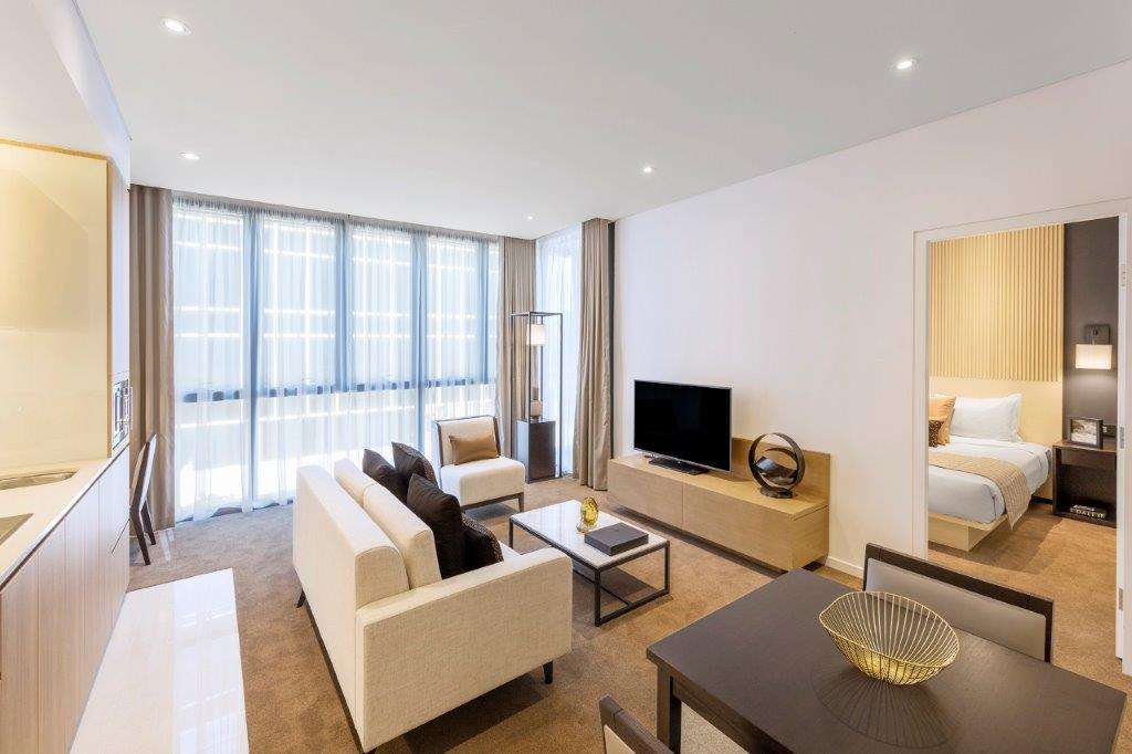 Skye Suites Sydney Ruang foto A living room at the hotel